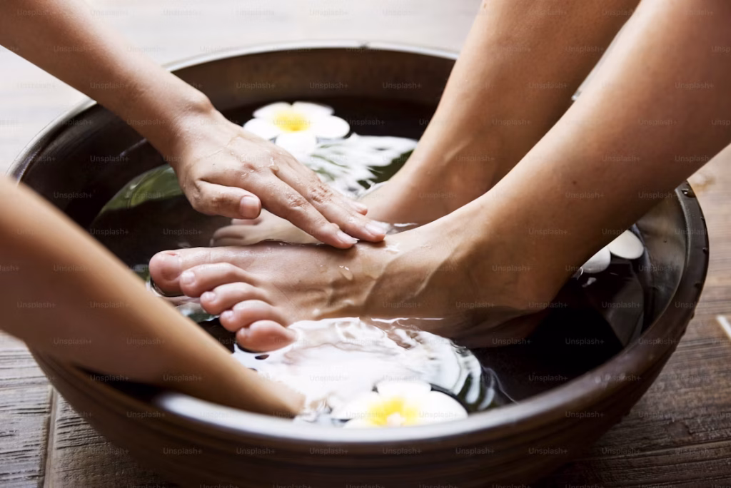 Therapist giving relaxing foot massage at Prana Wellness Spa Kochi/Ernakulam